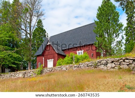 IRJANNE, EURAJOKI, FINLAND - JULY 6, 2013: Part of the museum complex in Irjanne. Wooden red church. Was built in 1731. It is the oldest wooden church in the province Satakunta