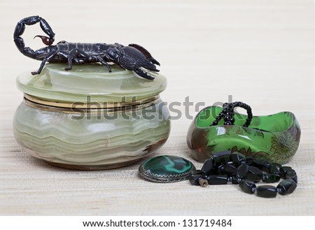 Emperor Scorpion on onyx jewelry box, malachite brooch and black necklace
