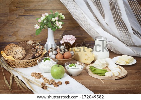 Still life of dairy products with bread, rural theme