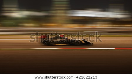 Formula 2.0 race car racing at high speed with motion blur on the background of the city in the dark