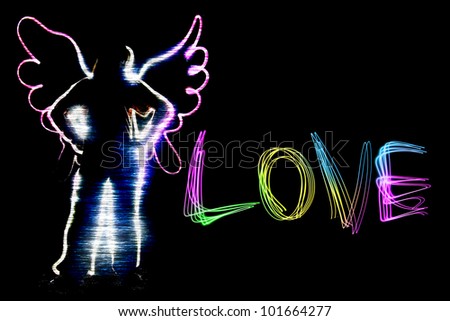 angel and love letter drawing by flashlight multiple color in the night