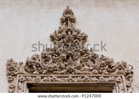 Details Of Thai Art  Stucco Decorated On A Window Frame Of  Ancient Temple