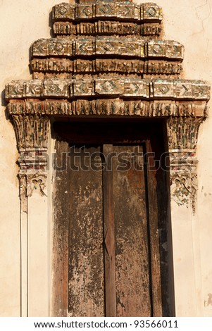thai art  stucco decorated on a window frame of ancient temple