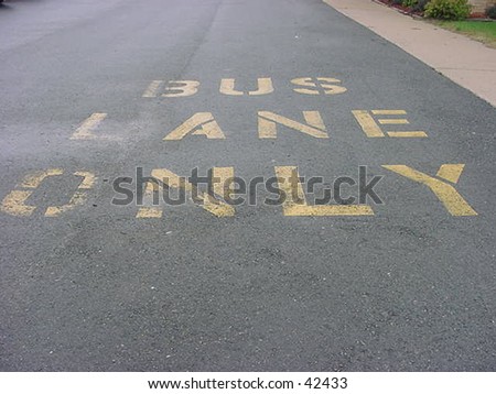 a bus lane only sign on parking lot