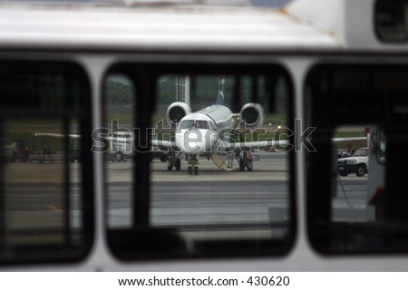 Jet waiting for take-off within bus frame