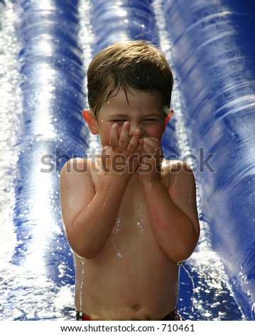 Clipart Water Slide. boy at end of water slide