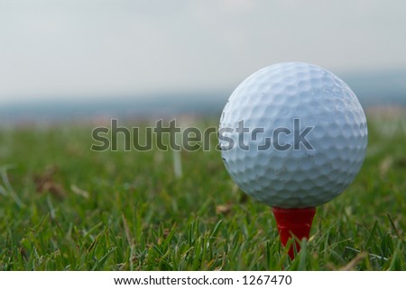 White golf ball on tee