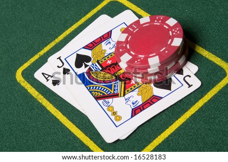 stock photo : Game of blackjack at a casino with chips on a green blackjack