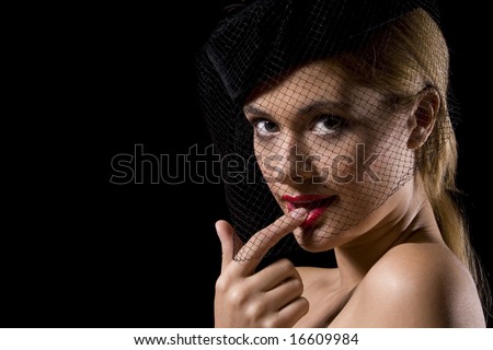 Attractive cabaret with net over her face and finger in mouth