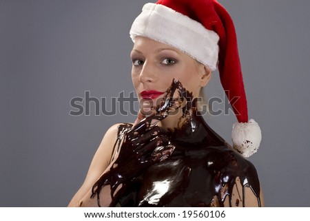 stock photo Attractive naked blond girl covered in chocolate wearing a 