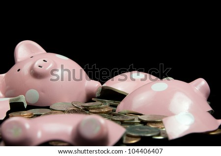 Broken piggy bank with cash & coins