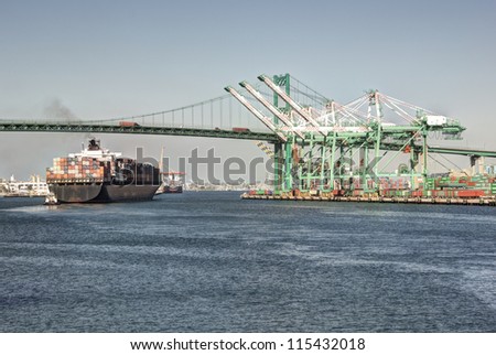 Huge container ship under the historic Vincent Thomas Bridge in San Pedro (Port of Los Angeles)