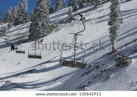 Single rider on chair lift at Mt. Baldy Ski Resort.
