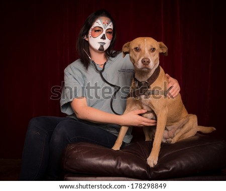 Day of The Dead veterinarian with stethoscope caring for large dog