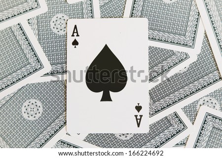 background of cards with black spade of ace on the top