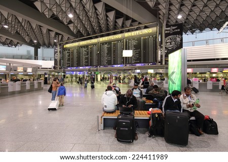 FRANKFURT, GERMANY - OCTOBER 17:, 2014: passengers walk to the terminal at the Frankfurt Airport, Germany on October 18, 2014.Frankfurt handled 57.5 million passengers annually.