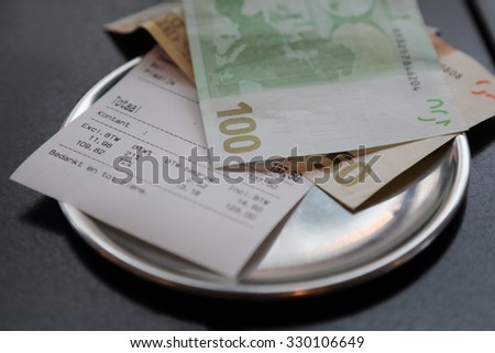 euro bank note payment for bill on on restaurant table