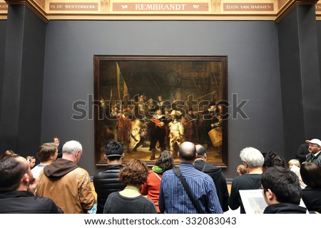 AMSTERDAM, THE NETHERLANDS -OCTOBER 21, 2015: Visitors looking at the famous The Night Watch by Rembrandt at the Rijksmuseum in Amsterdam on October 21,2015.