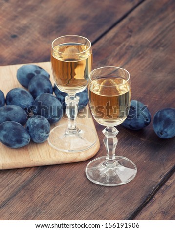 Plum brandy or schnapps with fresh and tasty plum