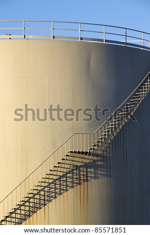 Shaded stairs on storage tank in Europoort, Rotterdam, Holland