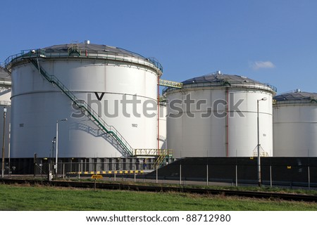 A series of oil tanks in the harbour of Rotterdam, Holland. Tanks are covered with light-weight domes.