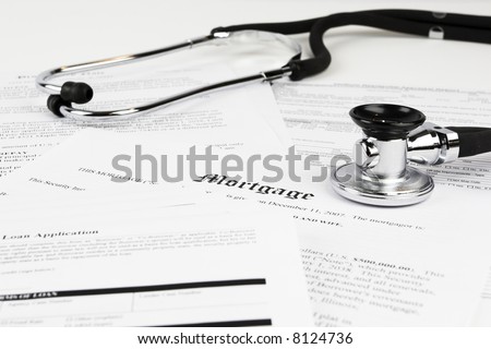 Mortgage documents with stethoscope