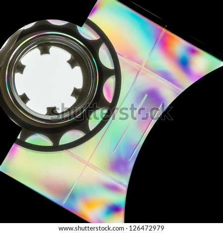 A colourful macro shot of a plastic cassette tape shot through linear polarising film.