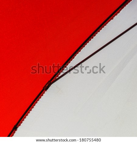 An abstract macro shot of a red and white umbrella.