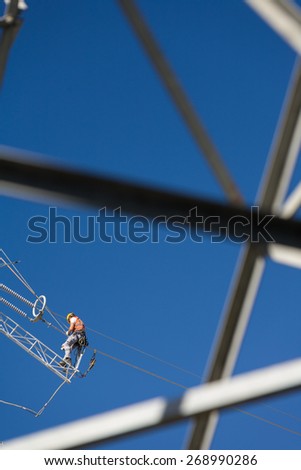 Workers repairing a high voltage industrial power energy line. Great for energy, safety and technology themes. : Almada, Portugal - October 02, 2008