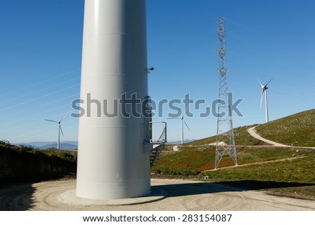 Wind Turbines on a modern windmill farm for alternative energy production.\
Electricity is powered ecological and considered better for the environment over oil and other fossil fuels.