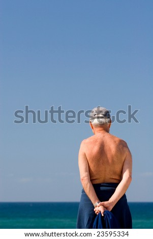 senior grandfather pensioner looking at the future and taking a sun bath