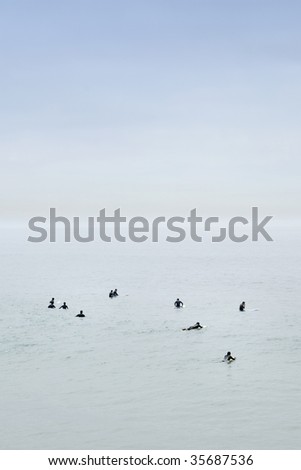 calm ocean surfers waiting for a great wave