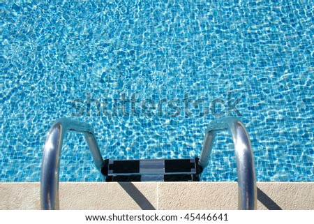 Hotel swimming pool with sunny reflections, great for summer and vacations themes and backgrounds