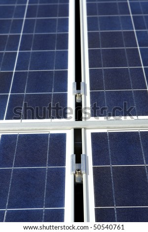 Modern solar photo voltaic panel close up with great blue cells details in a perspective view. Great for energy and environment themes.