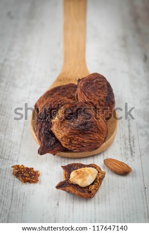 Home made dried fig fruits on a wooden spoon