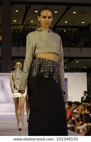BANGKOK - MAY 2 : A model wears clothes by Thai fashion students at the fashion design contest on May 2, 2012 at CTW Bangkok, Thailand. Accademia Italiana teams up with f.fashion to organize this event.