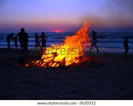 fire sunset party on the beach