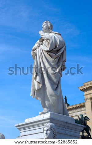 Detail of the French Dome and the statue of german poet Friedrich Schiller in Gendarmenmarkt Square in Berlin. The church was contructed by the Huguenot community between 1701 and 1705.