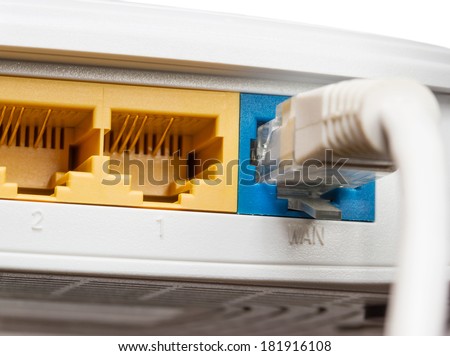 Router network hub with patch cable on isolated background