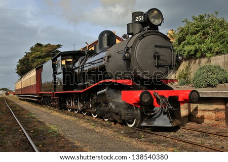 Walkers Ltd narrow gauge steam locomotive T251(c1917) with two carriages at Queenscliff railway station in Victoria, Australia.