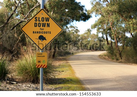 Australian road sign warning to slow down for bandicoots.