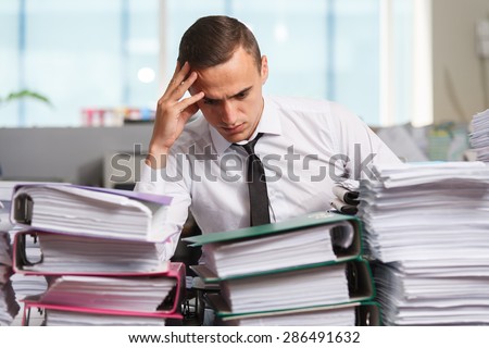 Stressful manager have so many paperwork in the office