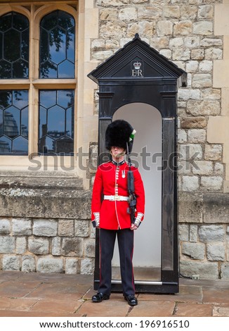 LONDON, ENGLAND MAY 31st: Guard stands guard outside tower of london crown jewels exhsibit on 31st May 2014 in London England.