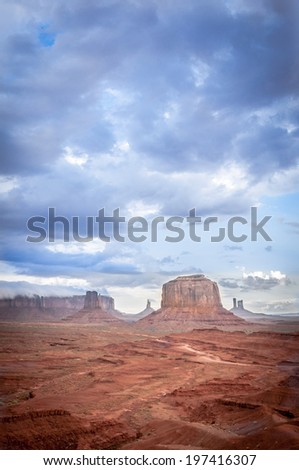 big cloud horizontal  on mesa in Monument Valley. Sandstone formation in Monument Valley before thunder.