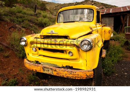 Jerome Arizona Ghost Town mine and yellow old car on AUGUST 26, 2013 in Jerome, USA