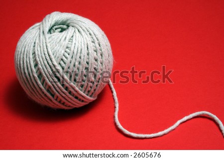 ball of string on red
