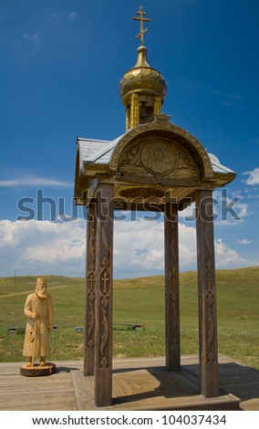 chapel and a wooden figure of an old man