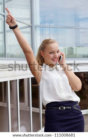 Young sexy businesswoman received good news on the phone