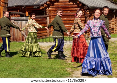 National Ensemble of young guys and beautiful girls dancing the Russian dance