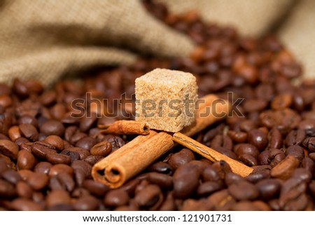 Mountain lake of coffee beans and cinnamon sticks in a boat